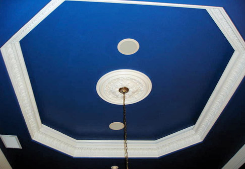 Dark blue ceiling above chandelier