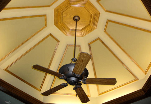 Light wood panels on wall near chandelier