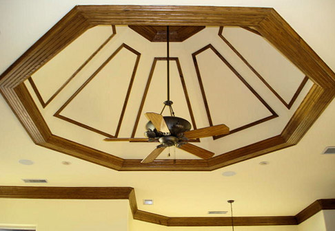 Dark wood panels on wall near chandelier