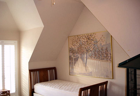 Bedroom nook with pale pink walls
