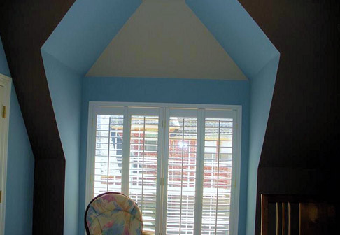 Window surrounded by pale blue walls
