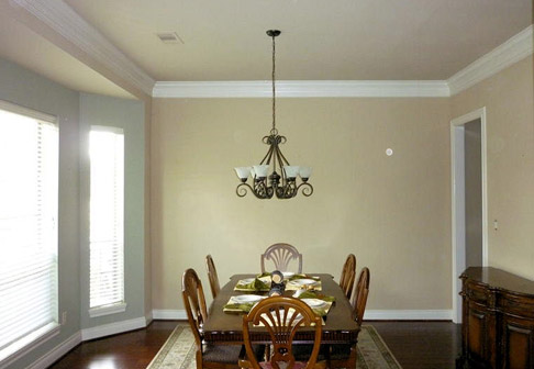 Dining area with pale yellow walls