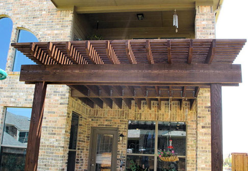 Newly painted dark wood pergola