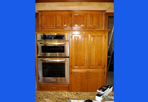 Light brown wooden cabinets in kitchen
