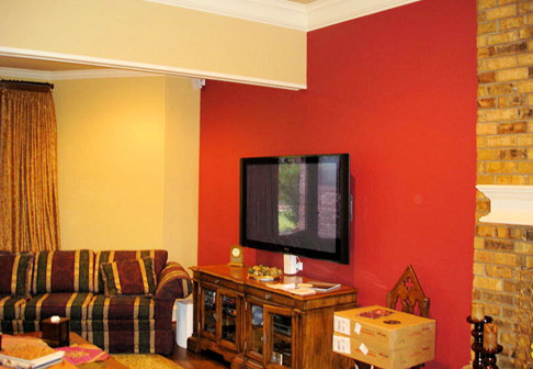 Living room with one yellow wall and one red wall