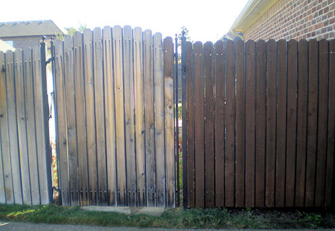 Freshly painted brown wooden fence