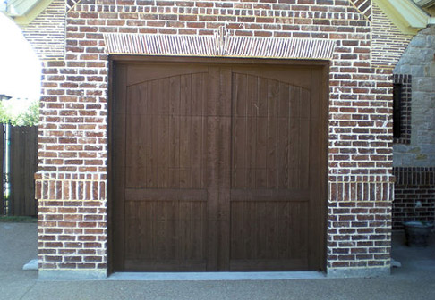 Garage door with a fresh coat of dark brown paint