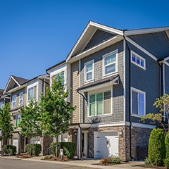 a row of painted condominium buildings