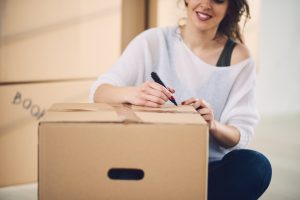 Woman packing stuff for moving