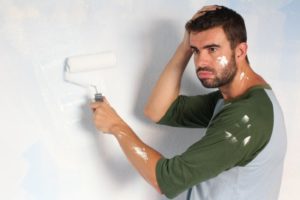 man making a mistake on exterior painting