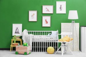 a children's room with green walls