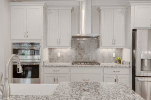 a kitchen with several stainless steel appliances