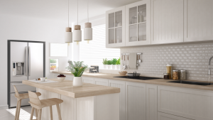 a modern kitchen with cabinets and white appliances 