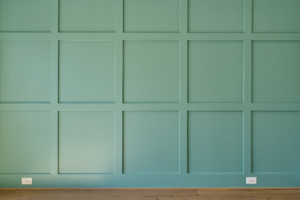 a green accent wall in a home office