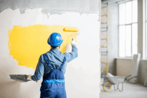 a person painting an accent wall