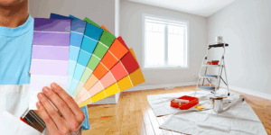 a professional painter holding paint sample cards