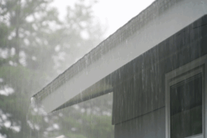 a close-up of a painted house in the rain
