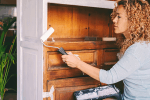 a homeowner painting their cabinets