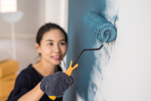 a homeowner painting her interior walls